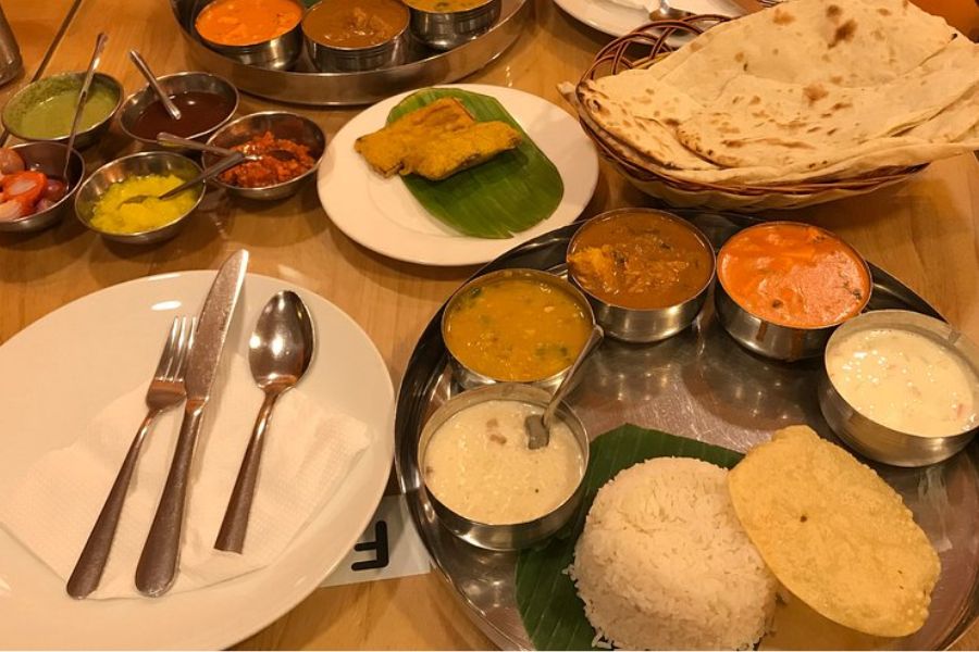 Indian Halal Thali with naan, rice, and curries at Baba’s Kitchen