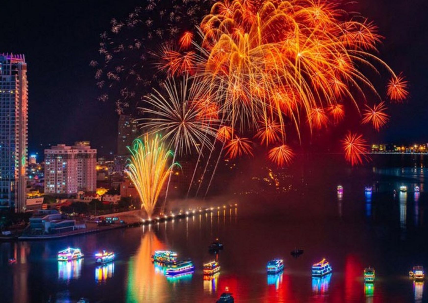 Colorful fireworks display reflecting on the Han River