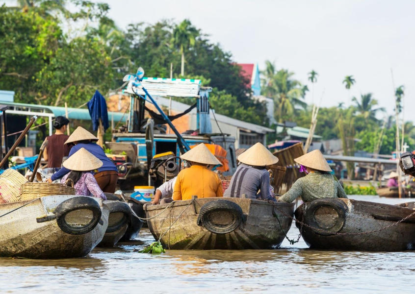 Local vendors at a floating market on the Mekong Delta waterways