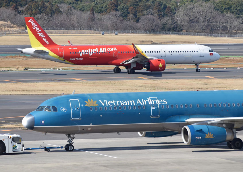 VietJet Air and Vietnam Airlines planes on airport tarmac