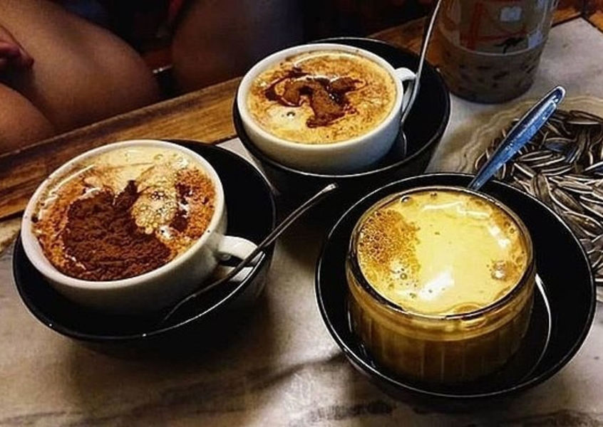 Vietnamese egg coffee served in traditional ceramic cups