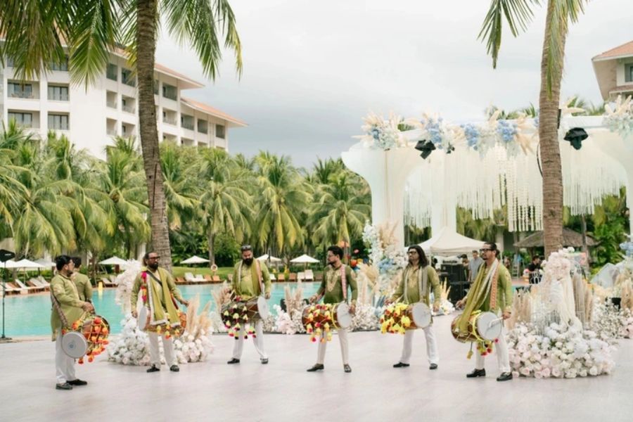 Indian baraat drummers parade poolside at Phu Quoc beach resort