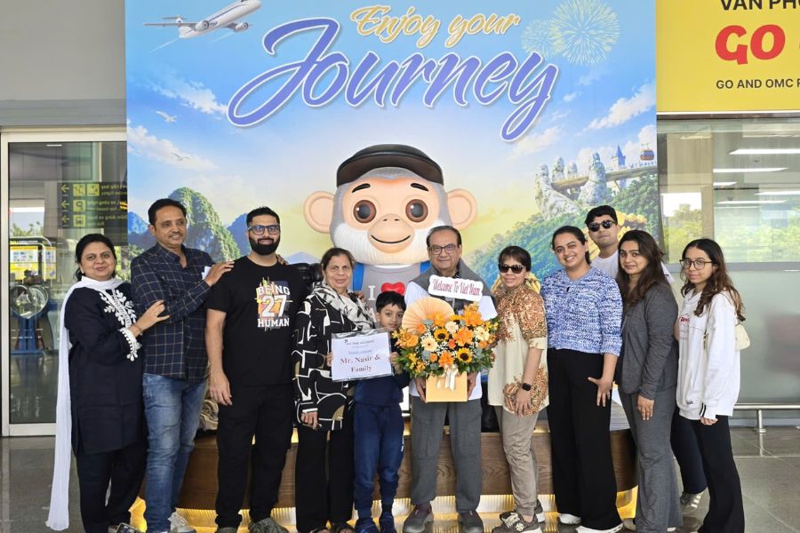 Vietnam DMC team welcoming Indian family group at airport
