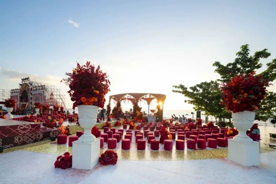 Red floral sunset wedding ceremony setup in Phu Quoc