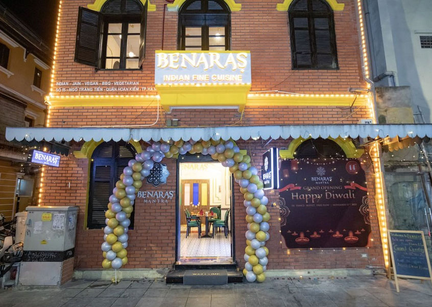 Benaras Mantra Hanoi restaurant exterior with balloon arch at night