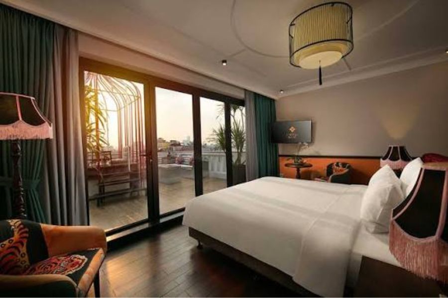 Boutique hotel bedroom with eclectic bohemian decor,