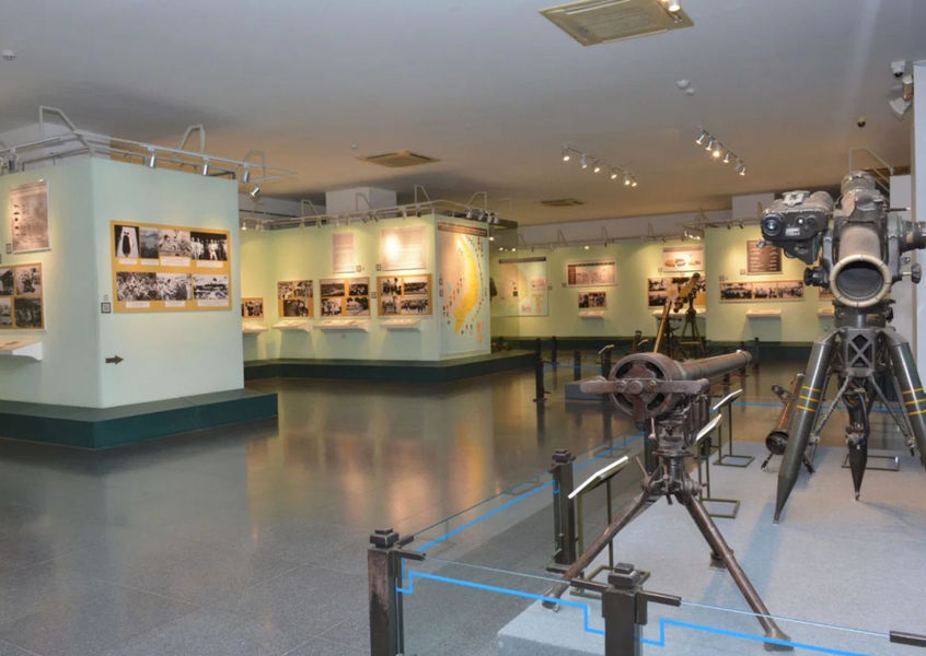 Museum exhibit hall with historical photo panels