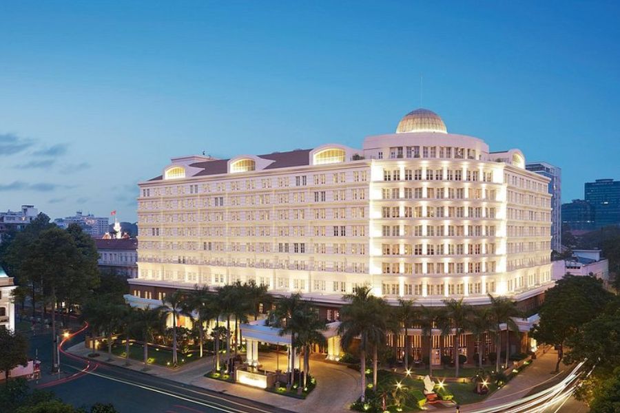 Park Hyatt Saigon's domed French colonial building illuminated at dusk
