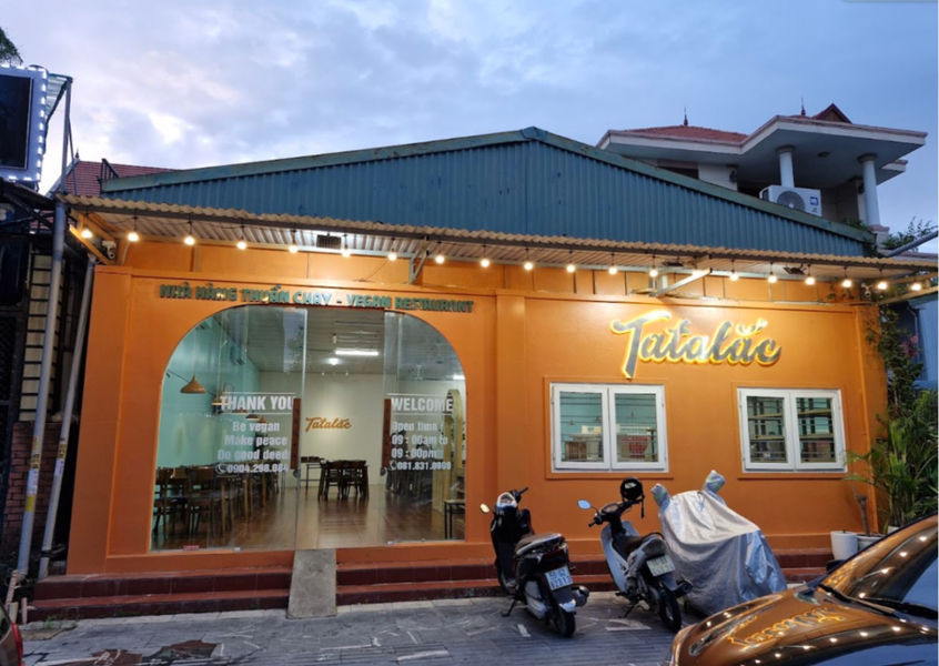 Tatalac Vegetarian Restaurant Quang Ninh storefront at dusk