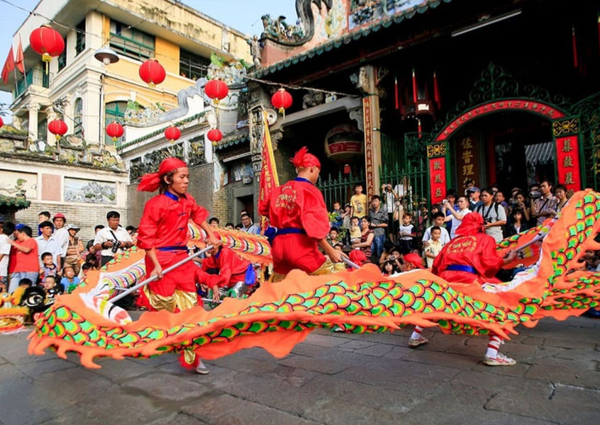Dragon dance performance outside a Chinese temple in Cho Lon, Ho Chi Minh City