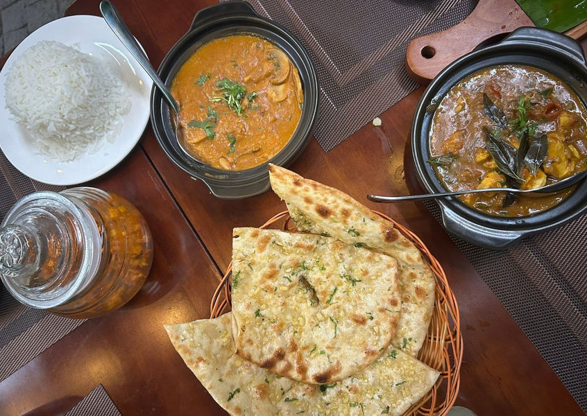 Curry, rice and garlic naan served at Kerala Palace Nha Trang