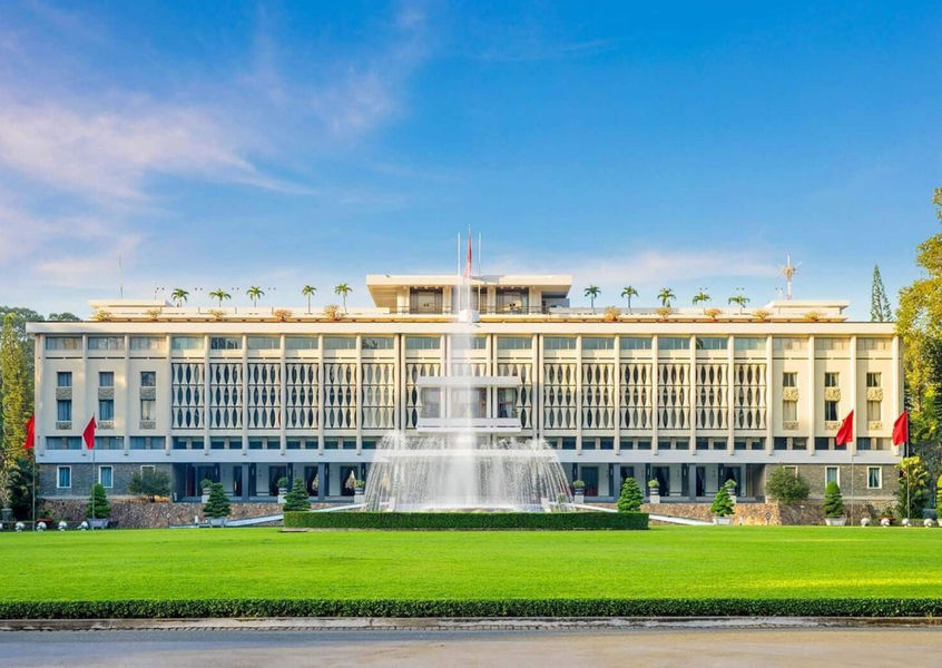 Reunification Palace facade with fountain and lawn in Ho Chi Minh City