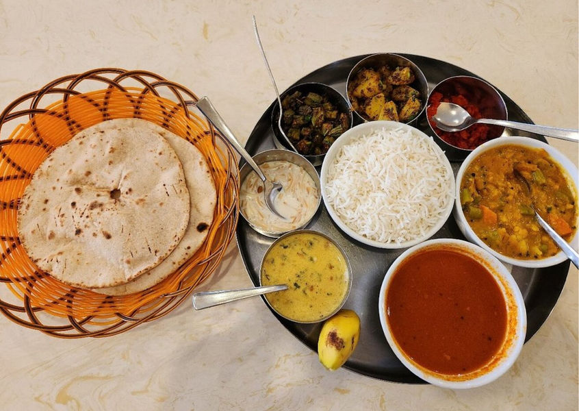 Indian thali set with rice, curries and roti at Yashoda Nha Trang